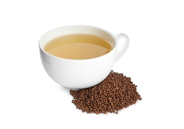 Buckwheat tea and granules on white background