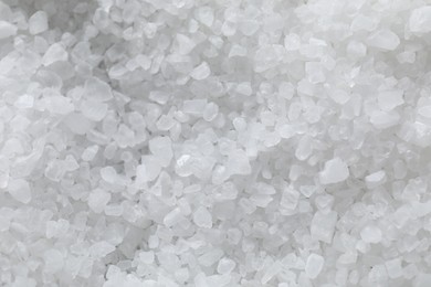 Photo of White natural salt as background, top view