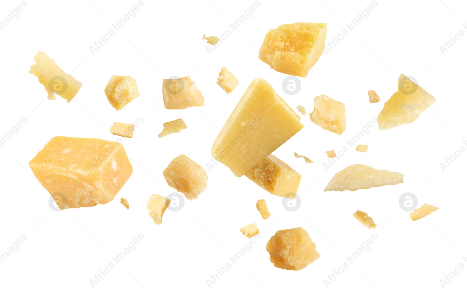Image of Pieces of delicious parmesan cheese flying on white background