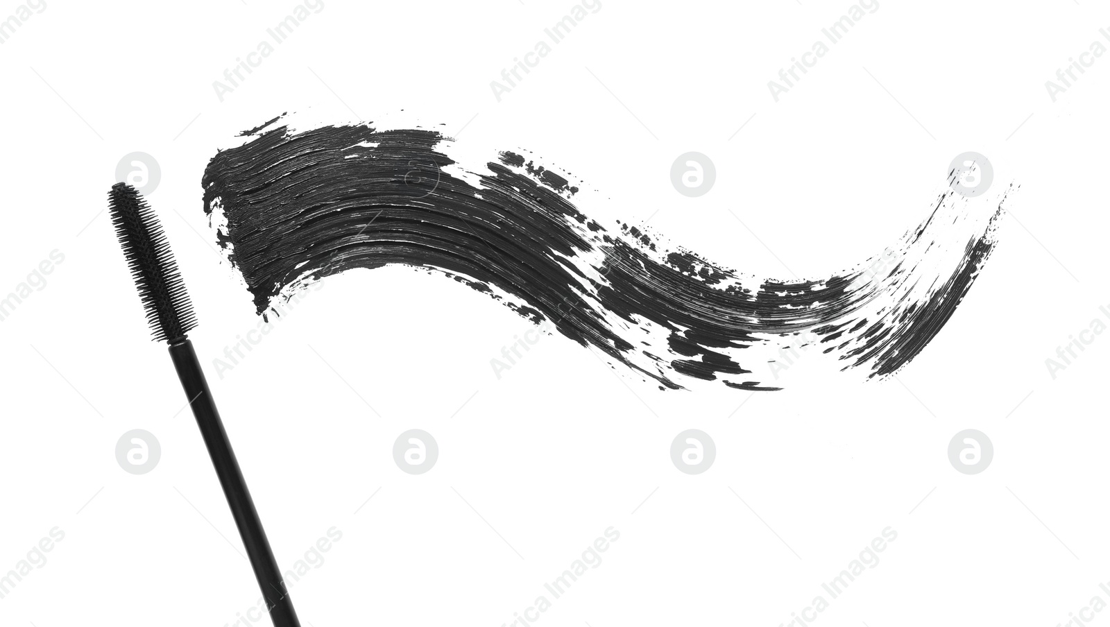 Photo of Smear of mascara and applicator isolated on white, top view