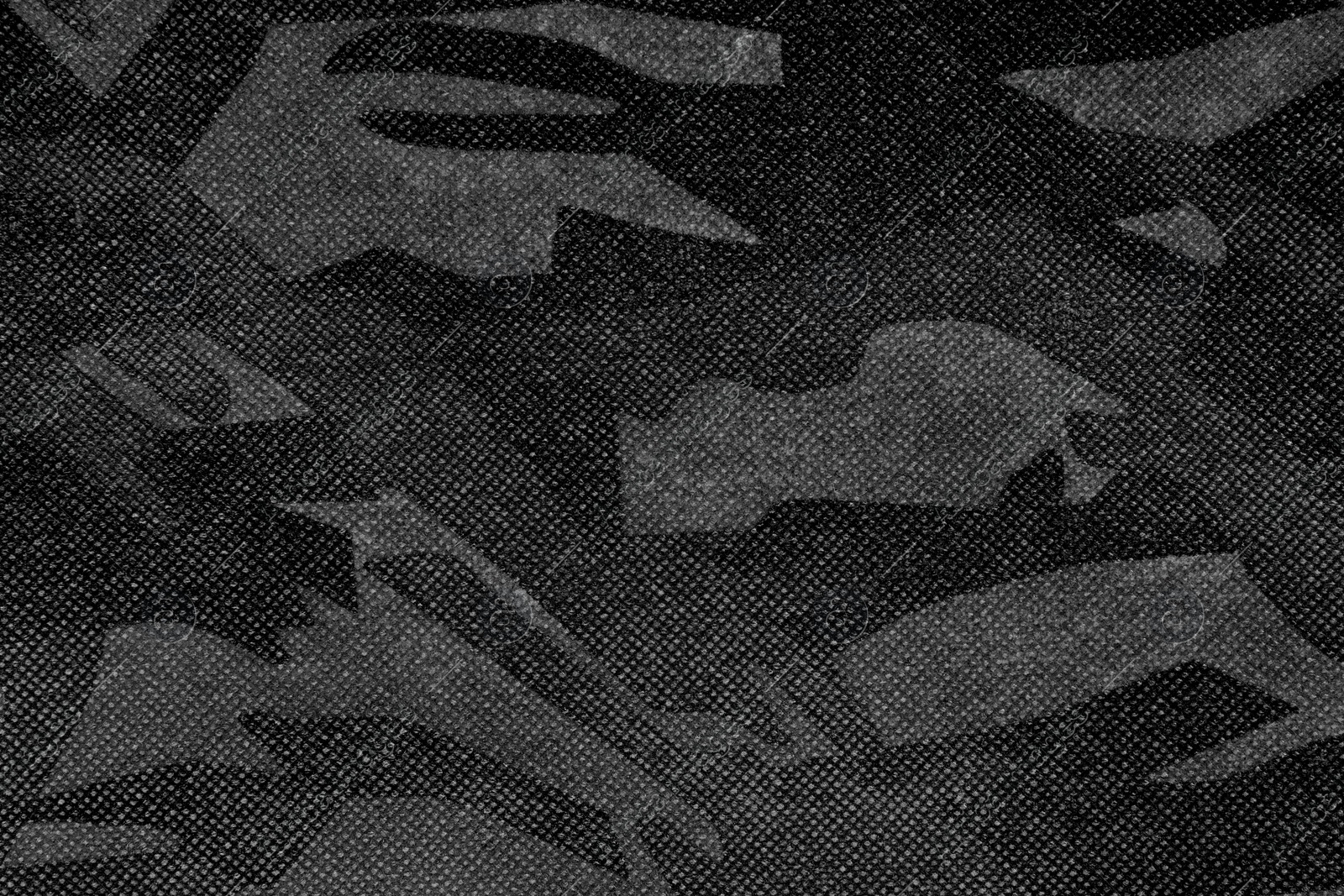 Image of Texture of camouflage fabric as background, top view. Black and white effect