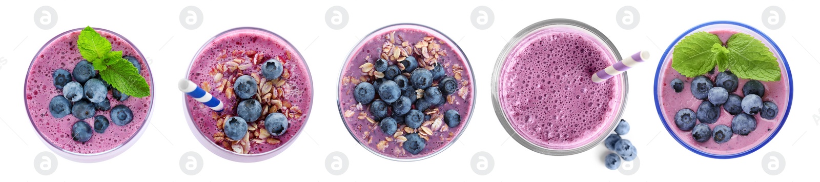 Image of Set with delicious blueberry smoothies on white background, top view. Banner design