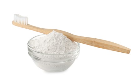 Photo of Glass bowl of tooth powder and brush on white background