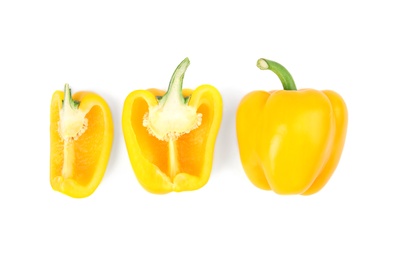 Whole and cut yellow bell peppers isolated on white