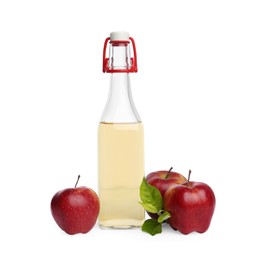 Photo of Bottle of delicious cider and red apples isolated on white