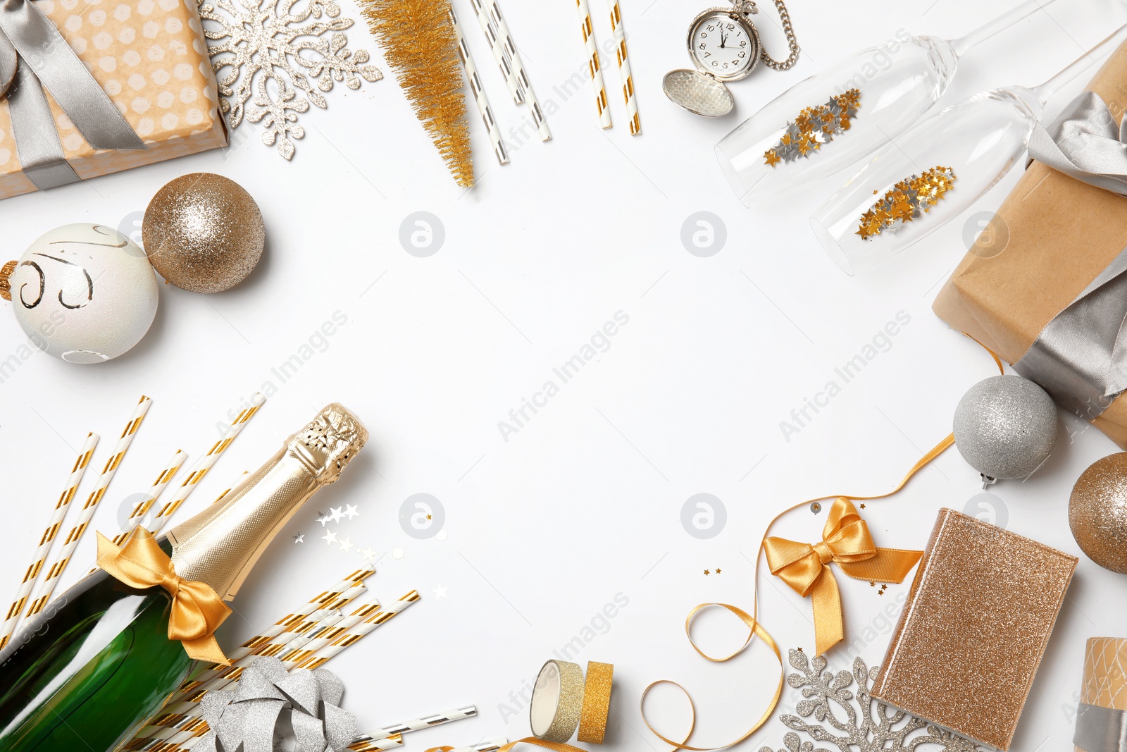 Photo of Creative flat lay composition with bottle of champagne and party accessories on white background. Space for text