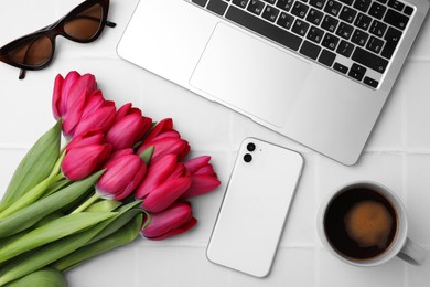 Photo of Flat lay composition with beautiful tulips and laptop on white table