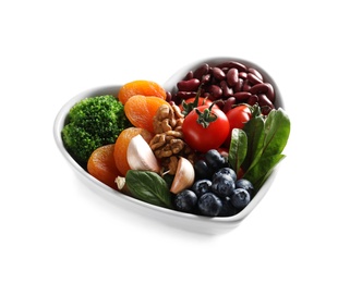 Photo of Bowl with products for heart-healthy diet on white background