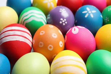 Photo of Colorful Easter eggs with different patterns as background, closeup