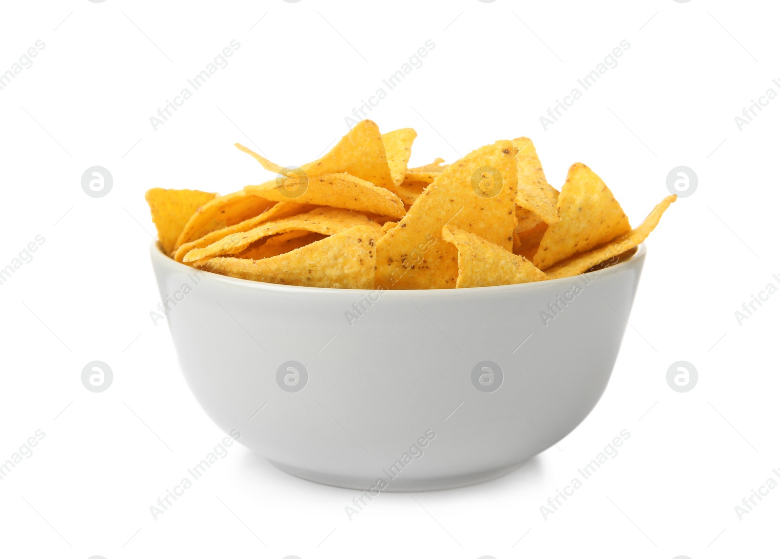 Photo of Ceramic bowl of Mexican nachos chips on white background