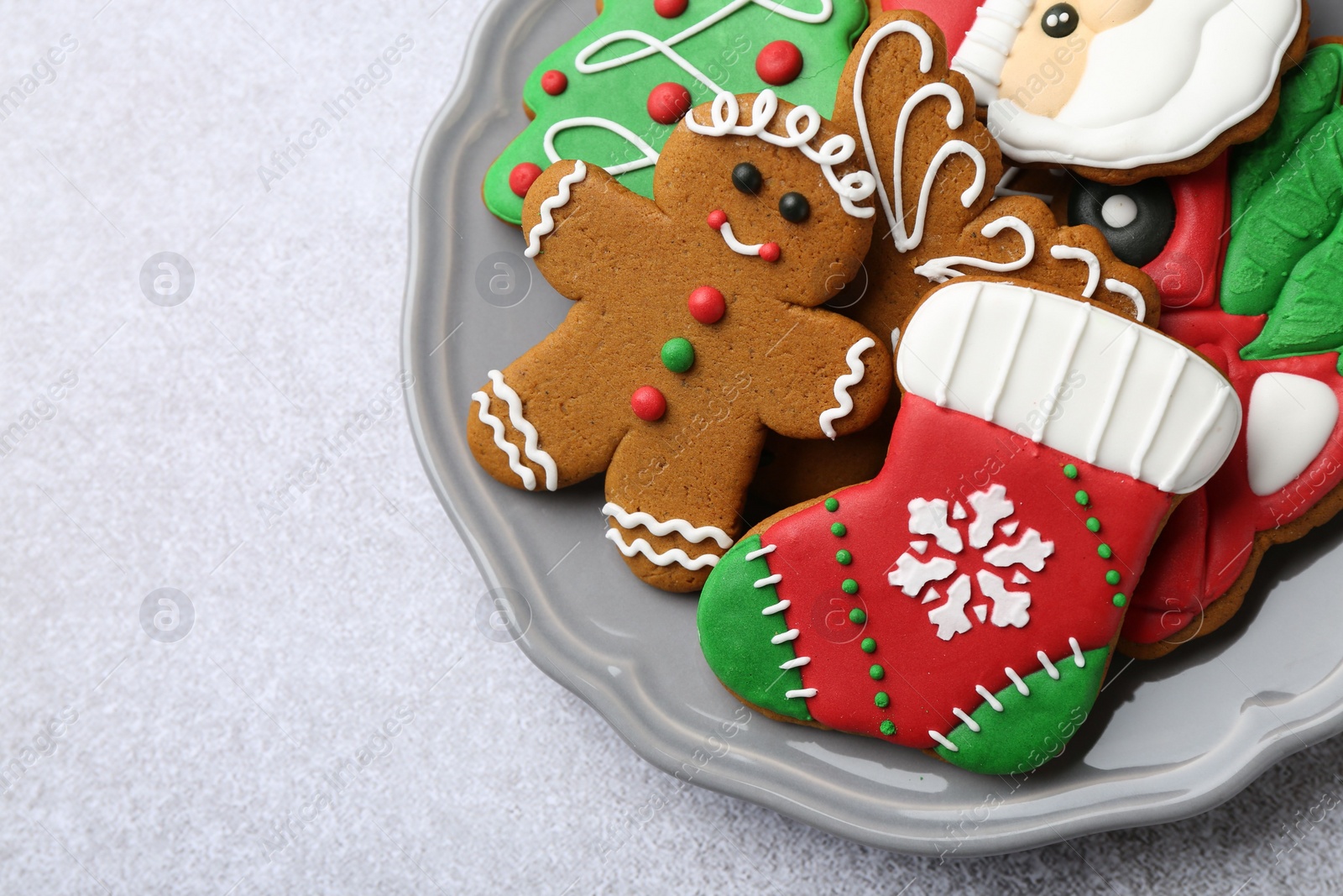 Photo of Tasty homemade Christmas cookies on light grey table, top view. Space for text