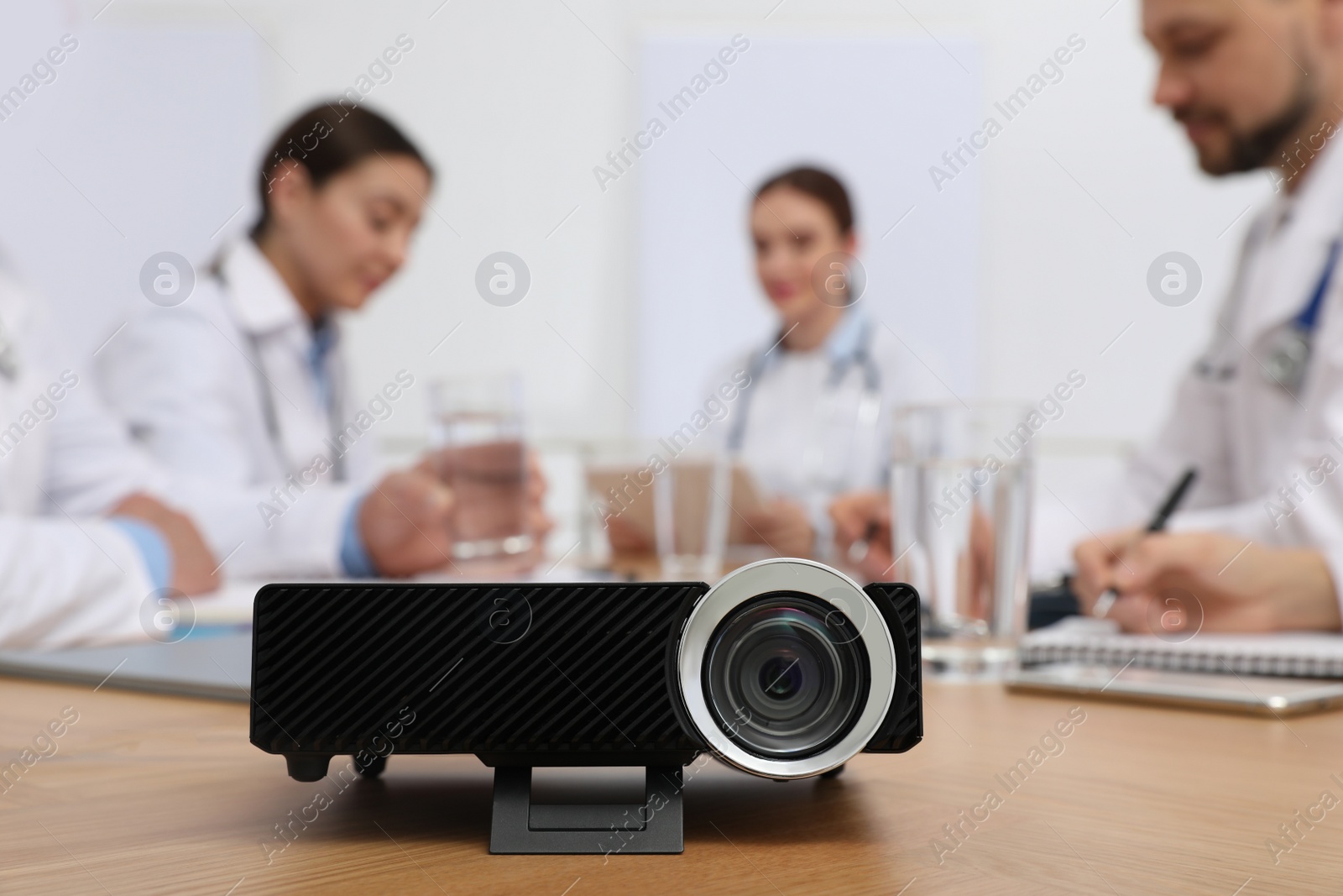 Photo of Video projector on table during medical conference