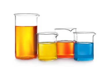 Photo of Laboratory glassware with color liquids on white background