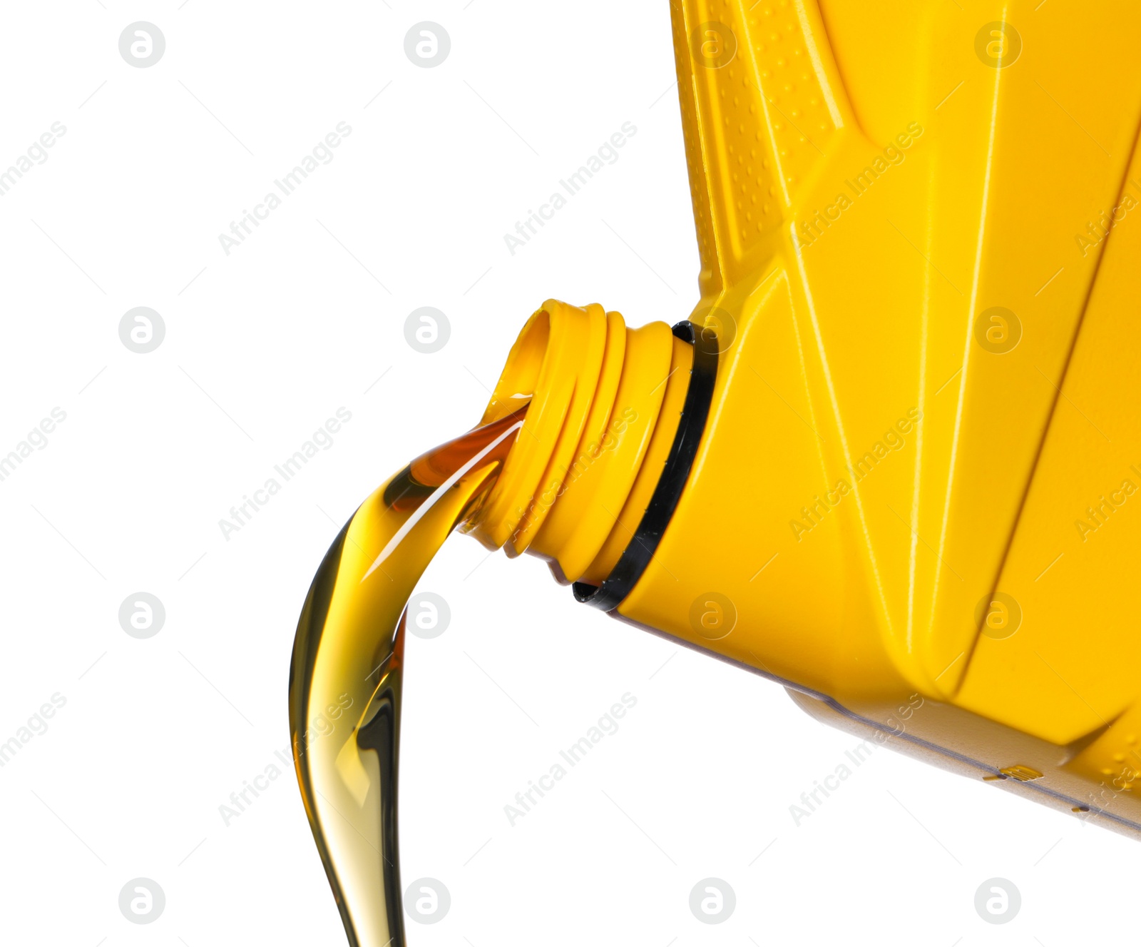 Photo of Pouring motor oil from yellow container on white background, closeup