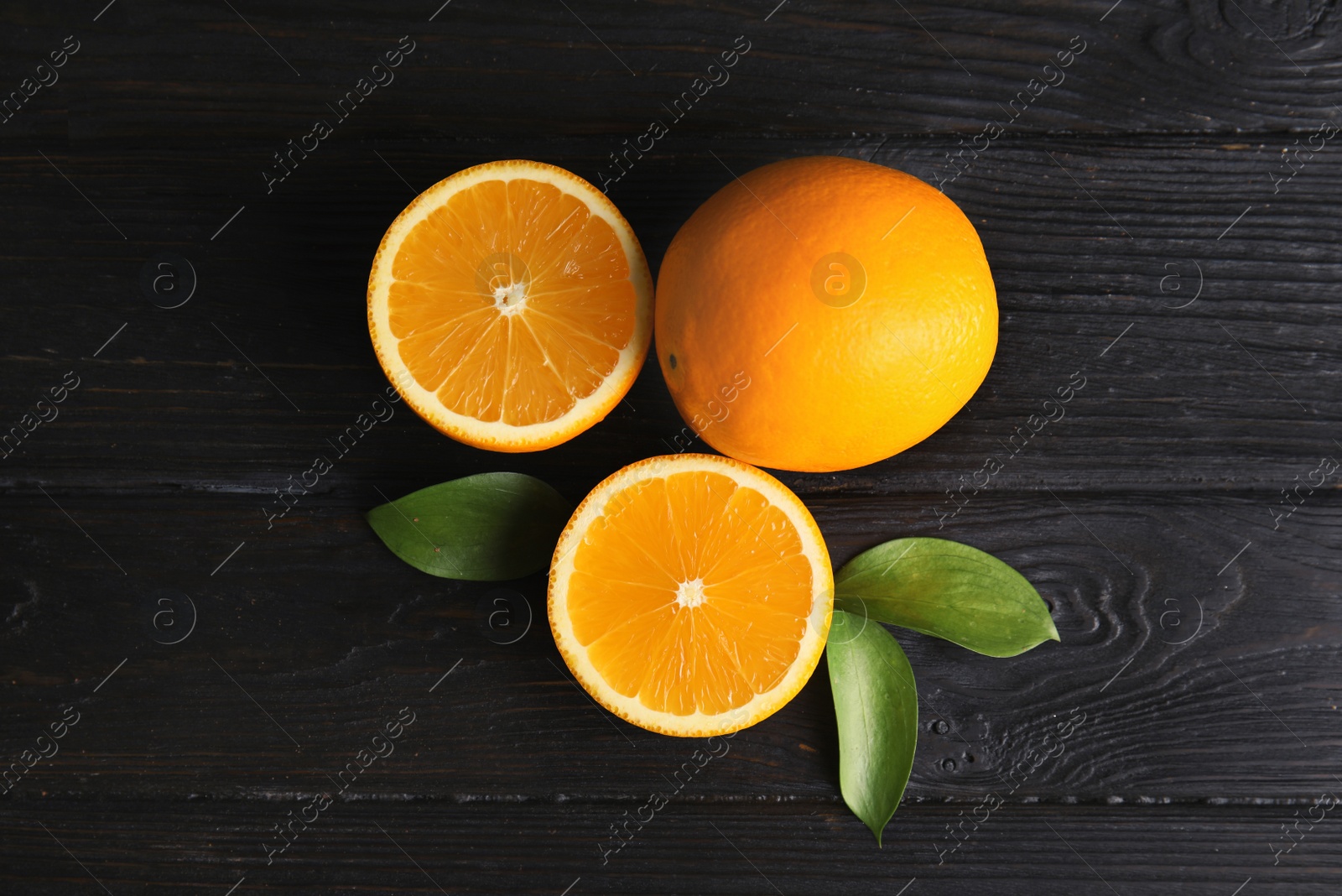 Photo of Flat lay composition with fresh oranges on wooden table