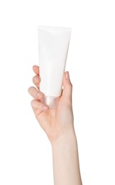 Woman holding tube of face cleansing product on white background, closeup