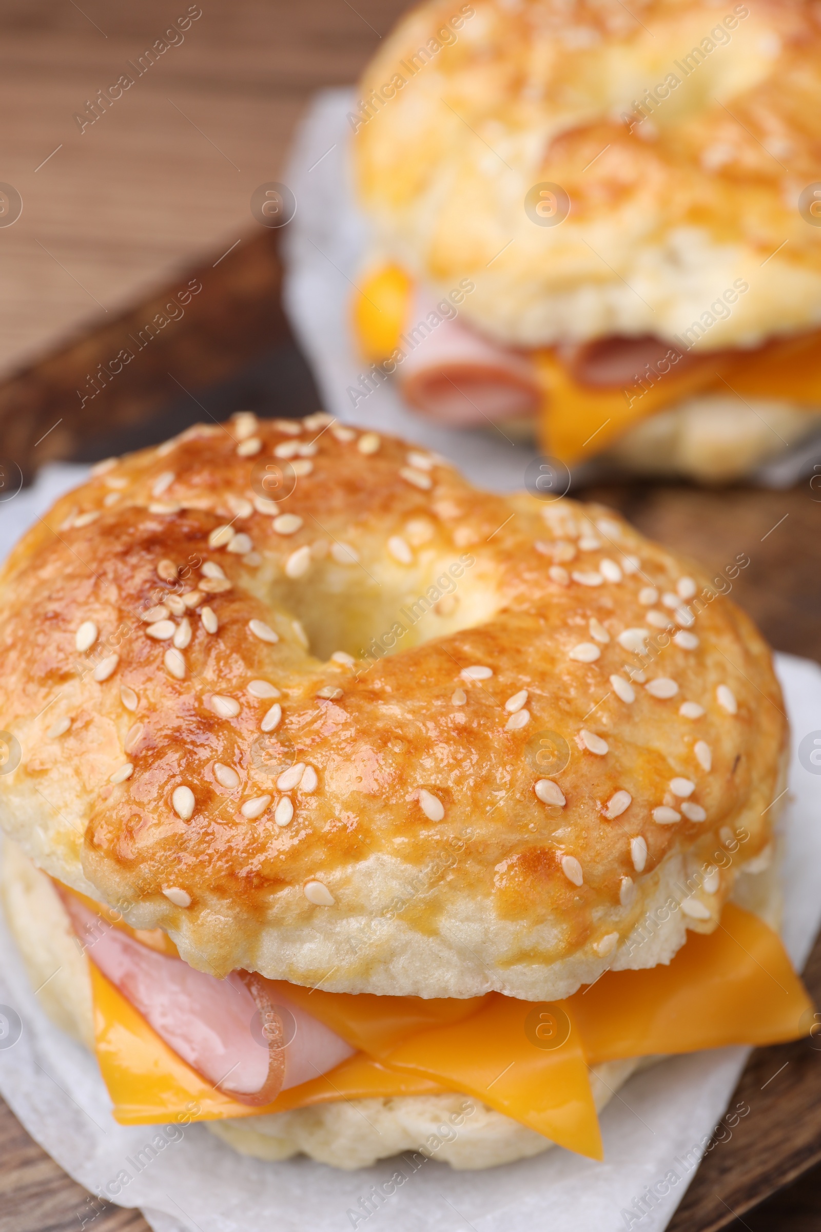 Delicious bagels with ham and cheese on table, closeup Photo of Delicious bagels with ham and cheese on table, closeup