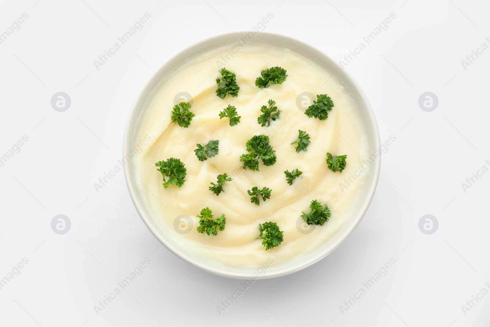 Photo of Bowl with tasty mashed potatoes on white background, top view