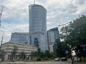 Photo of WARSAW, POLAND - JULY 13, 2022: Beautiful view of modern buildings on city street