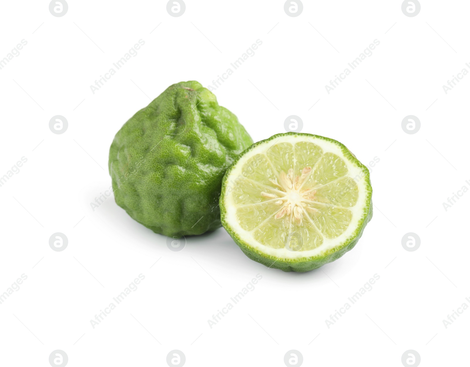 Photo of Whole and cut ripe bergamot fruits on white background