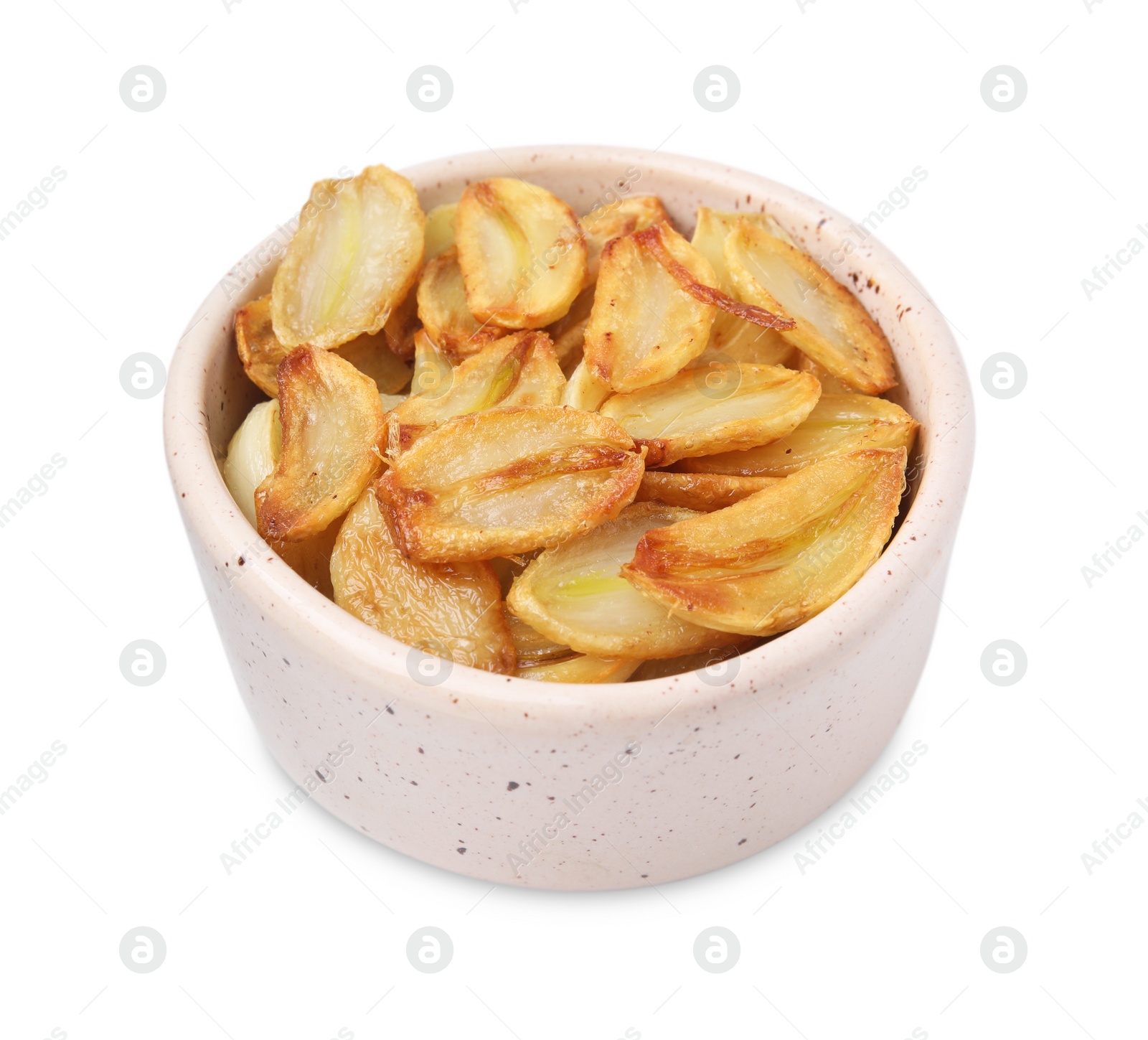 Photo of Fried garlic cloves in bowl isolated on white