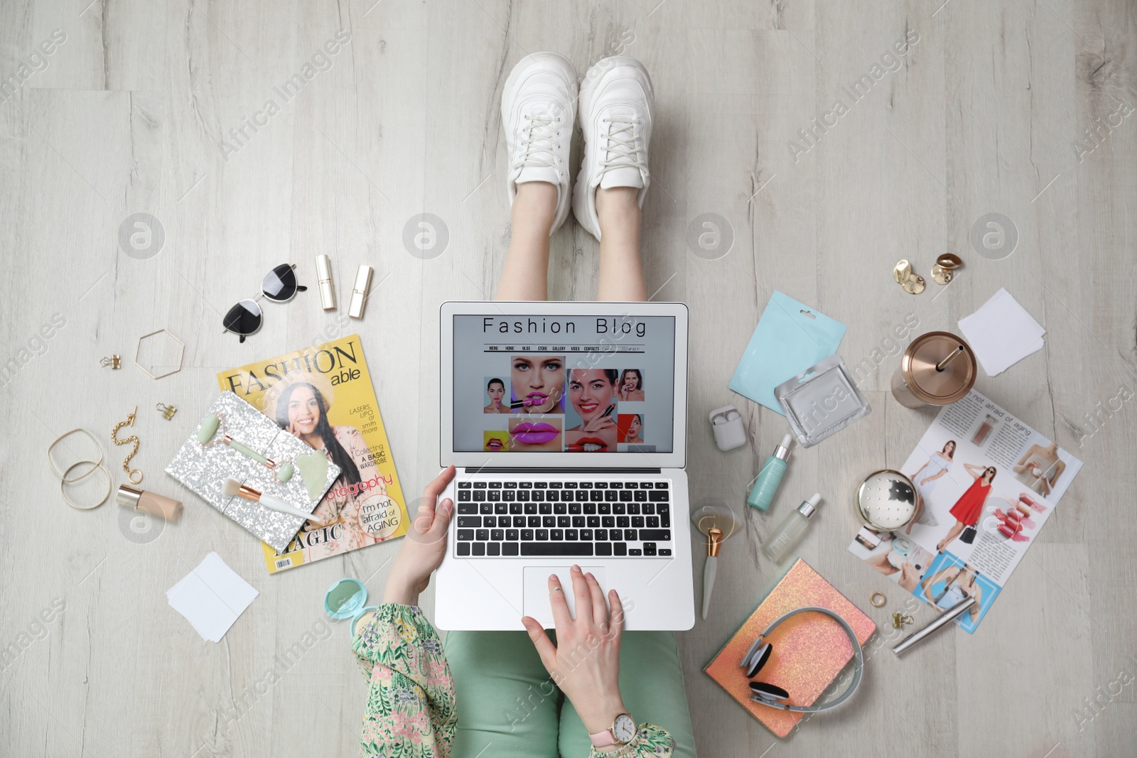 Photo of Fashion blogger with laptop on floor, top view