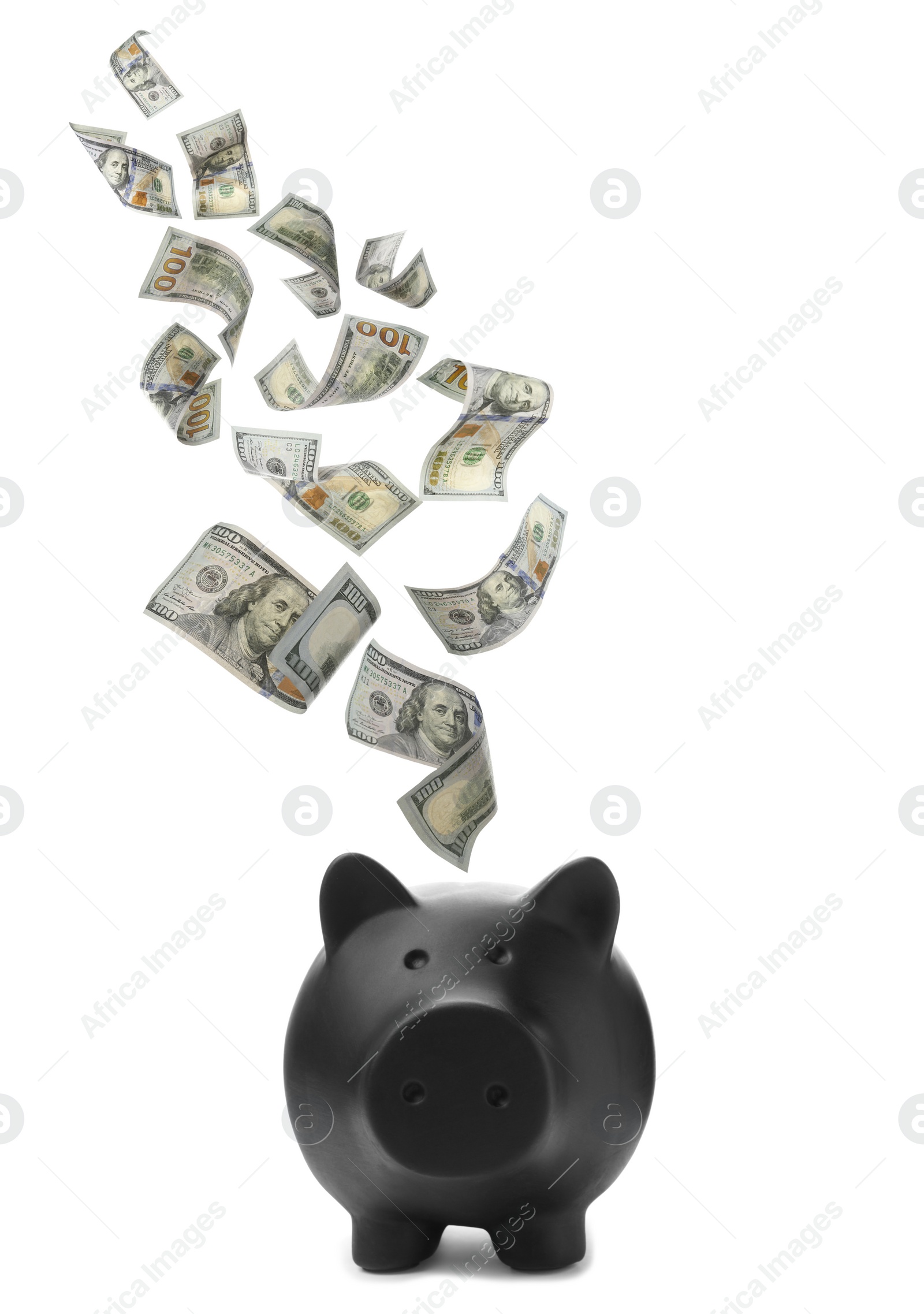 Image of Dollars falling into black piggy bank on white background 