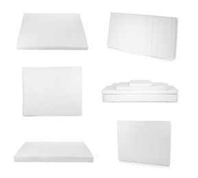 Image of Set with modern comfortable mattresses on white background 