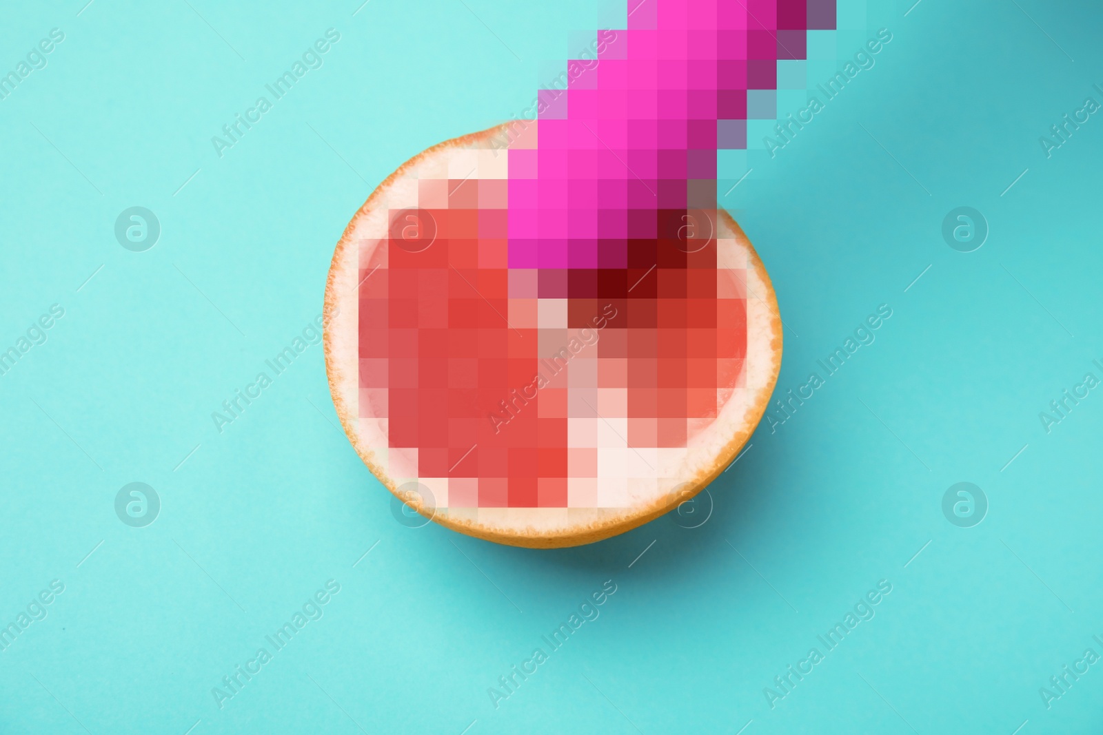 Image of Half of grapefruit and purple vibrator on turquoise background, above view. Sex concept