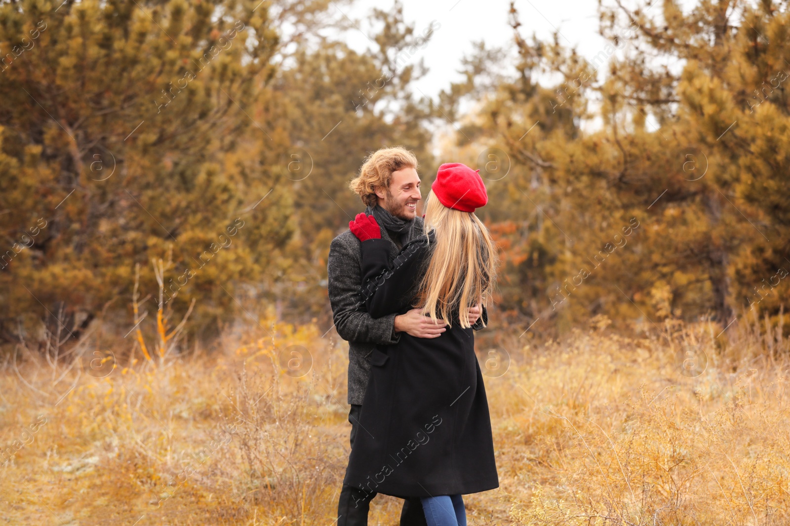 Photo of Young romantic couple in park on autumn day