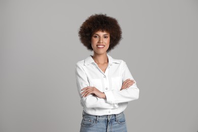 Photo of Portrait of beautiful young woman on grey background