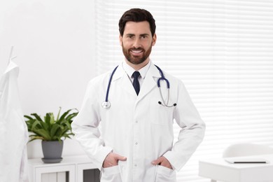 Photo of Portrait of medical consultant with stethoscope in clinic