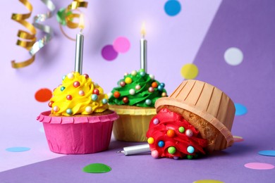 Photo of Dropped cupcake among good ones on color background. Troubles happen
