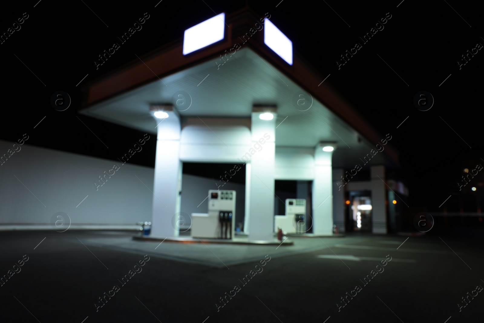 Photo of View of modern gas station at night outdoors