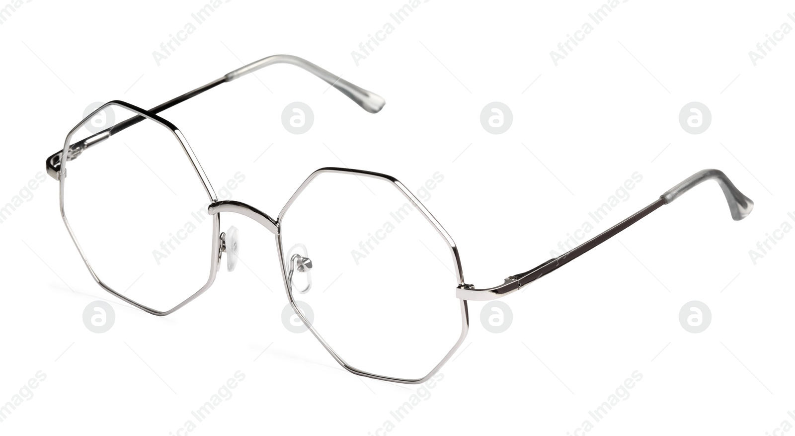 Photo of Stylish glasses with metal frame isolated on white