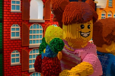 Photo of AMSTERDAM, NETHERLANDS - AUGUST 06, 2022: Human figures made with colorful Lego constructor indoors, space for text
