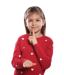 Little girl showing HUSH gesture in sign language on white background