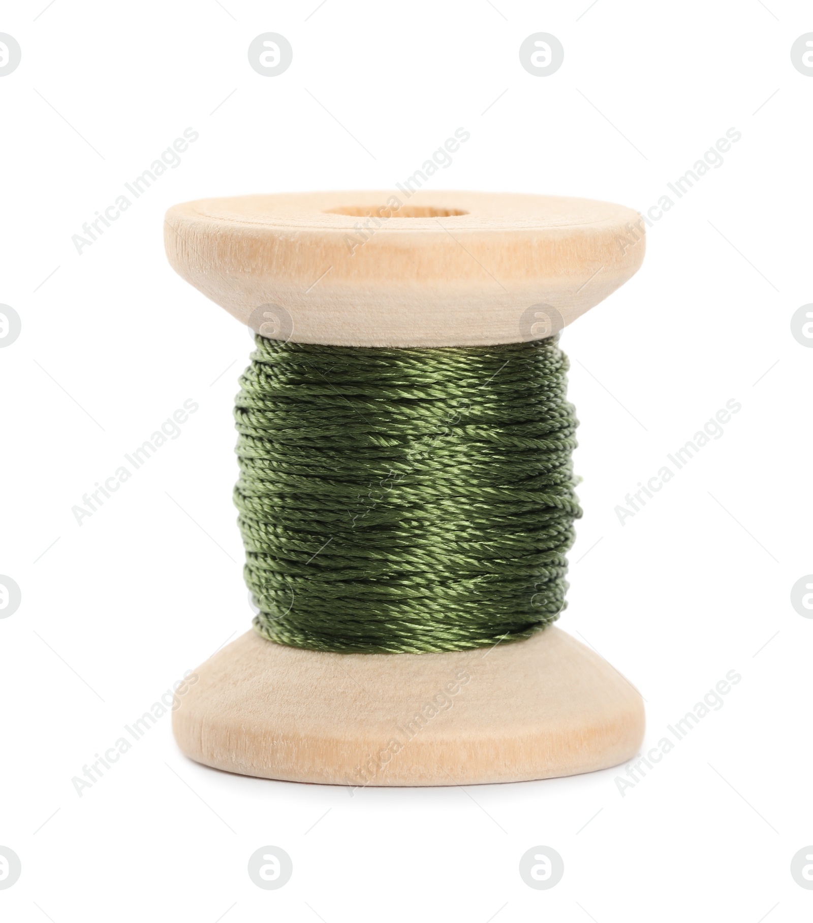 Photo of Wooden spool of olive green sewing thread isolated on white