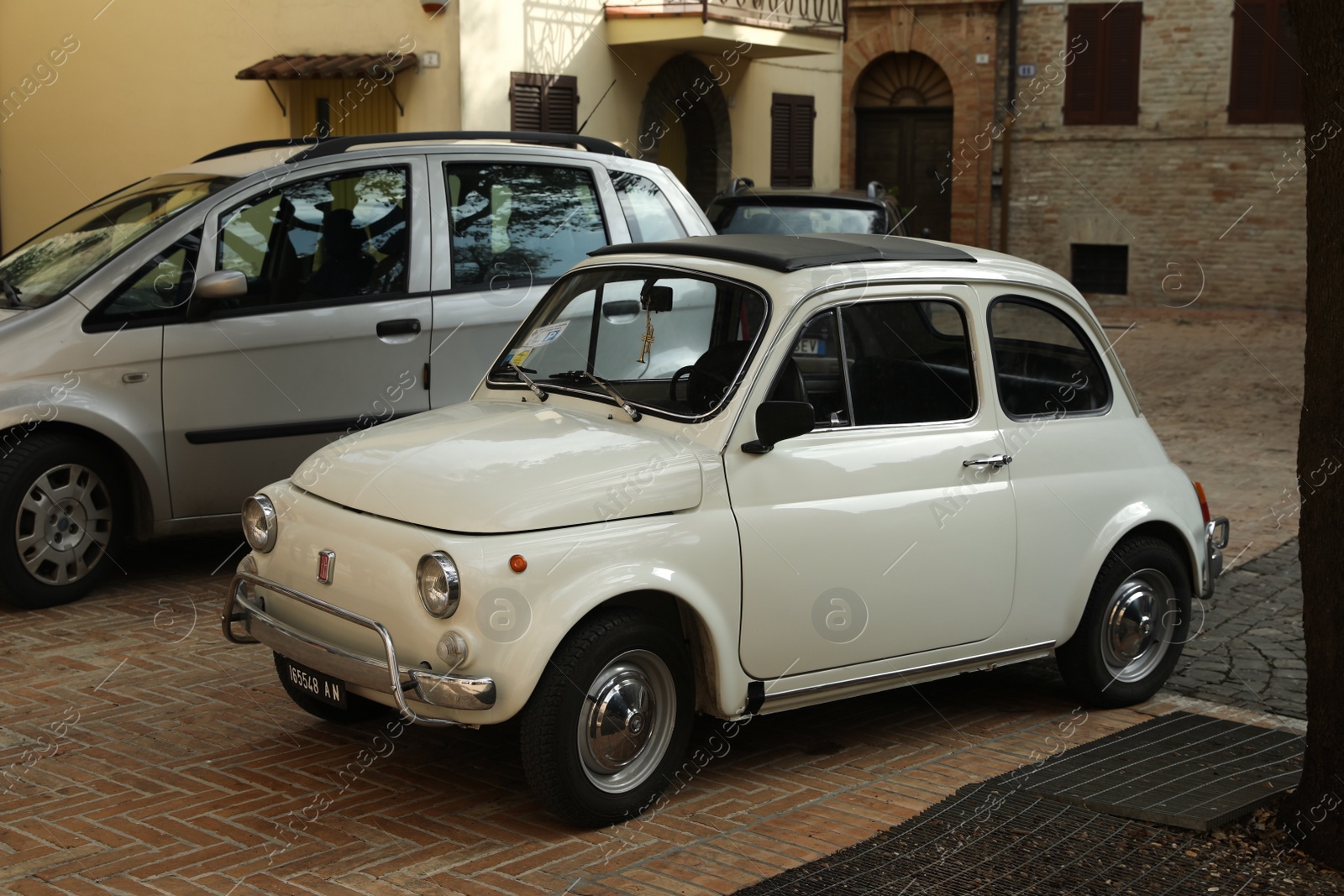 Photo of GRONINGEN, NETHERLANDS - APRIL 23, 2022: White Fiat 500F 1968 parked on city street