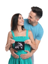 Photo of Happy young family with ultrasound picture on white background