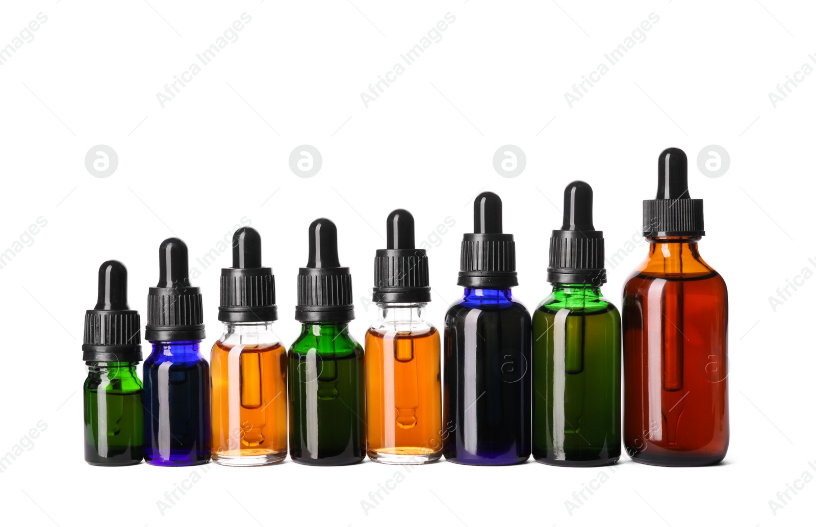 Photo of Cosmetic bottles of essential oils on white background