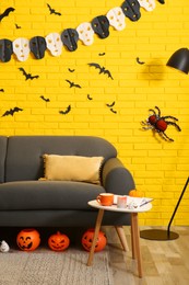 Photo of Modern room decorated for Halloween. Festive interior