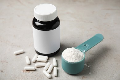 Amino acid pills and powder on grey table