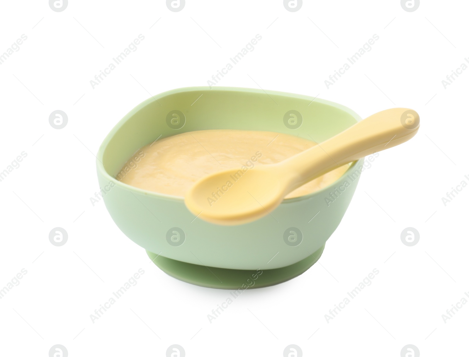 Photo of Tasty baby food in bowl and spoon isolated on white