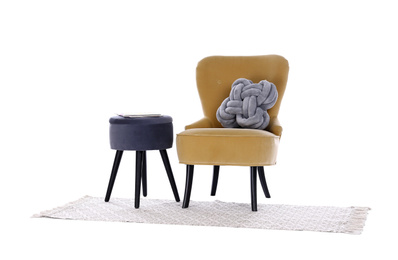 Comfortable armchair, rug and stool isolated on white