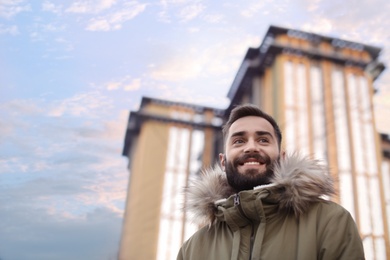 Photo of Portrait of stylish young man on city street