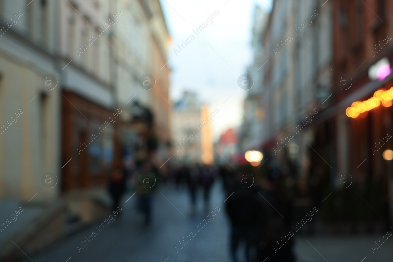 Photo of Blurred view of people walking on city street