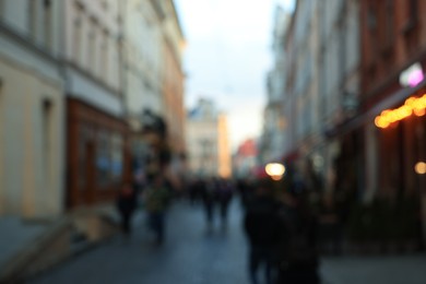 Blurred view of people walking on city street