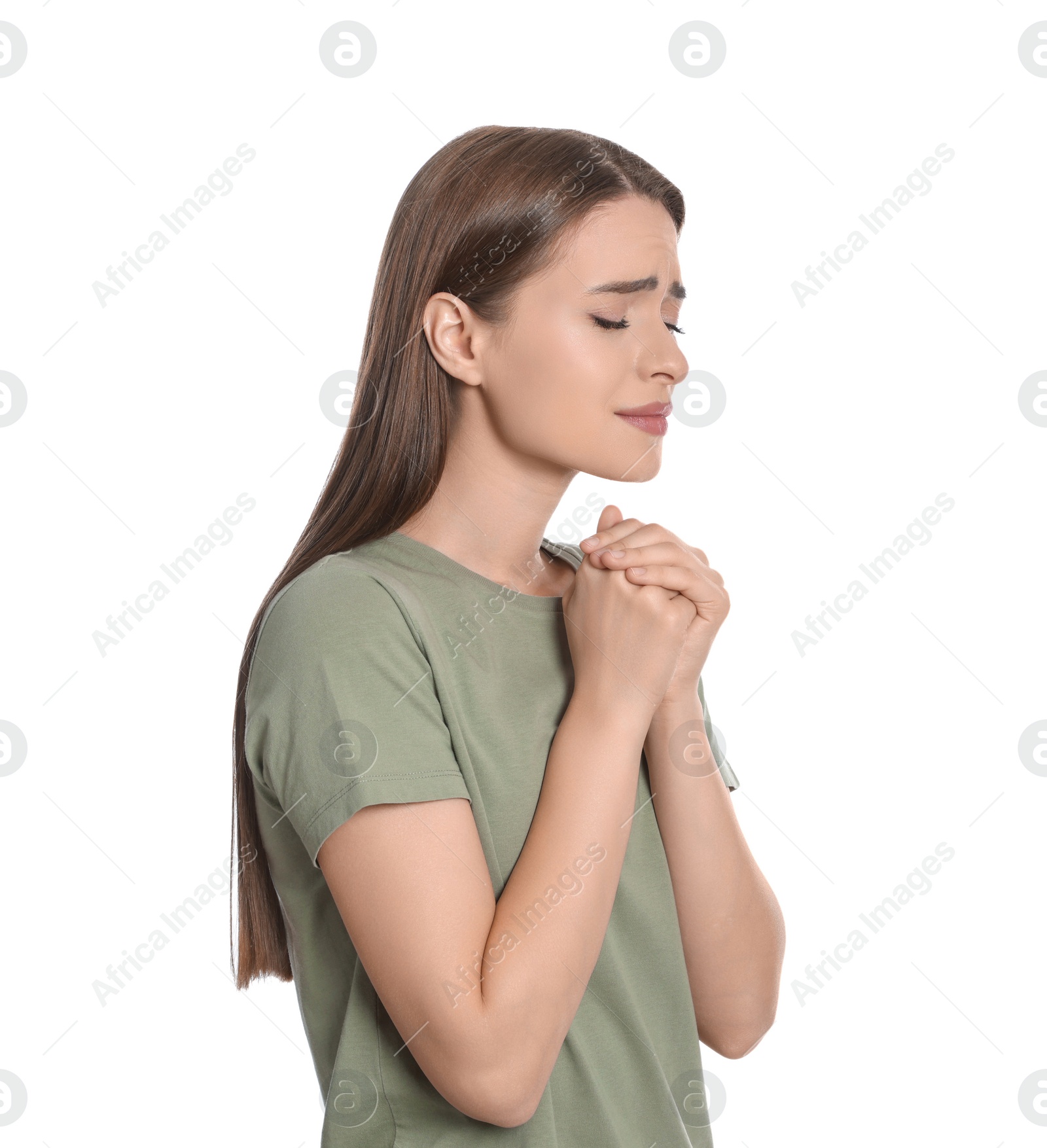 Photo of Woman with clasped hands praying on white background