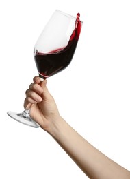 Photo of Woman with red wine splashing out of glass on white background, closeup